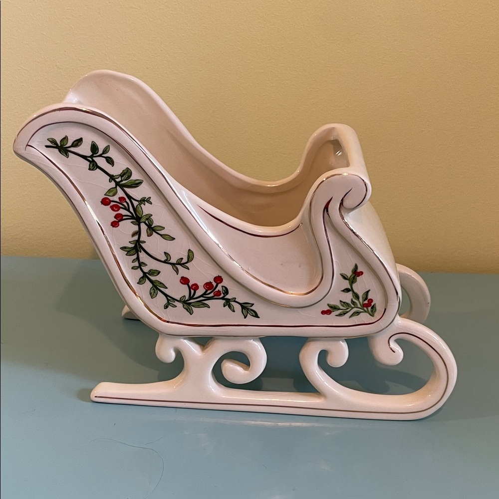 FTD Ceramic Sleigh with Holly Accents